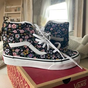 Little Girl high top patterned Vans never worn. Come with original box.